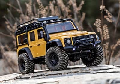 97054-1-TRX4m-Defender-Action-Tan-3qtr-Front-Grass-4101